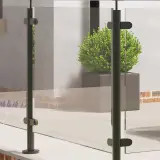 Image of a glass balustrade with black posts.